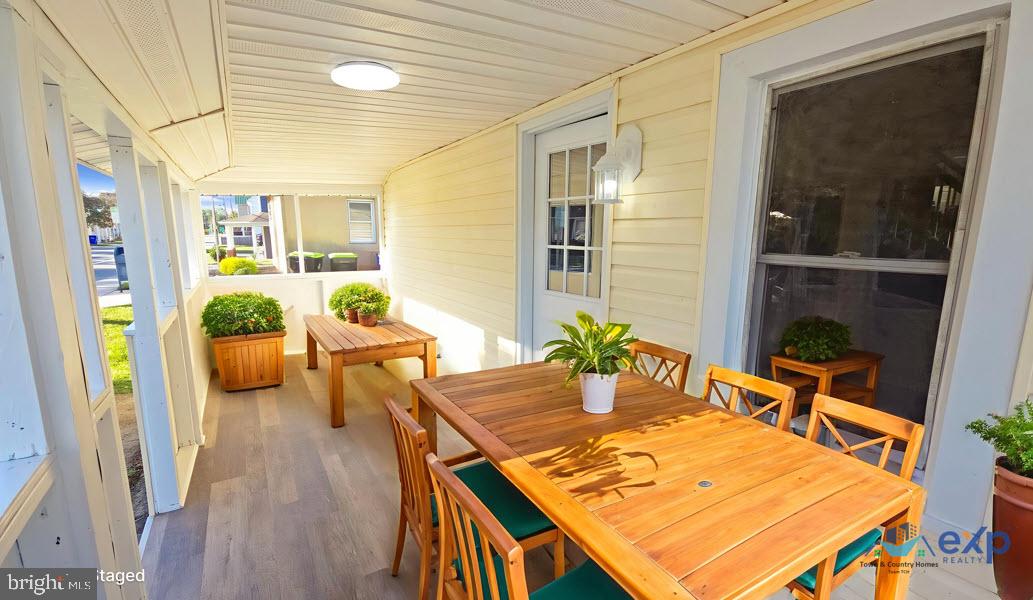 233 Main Street Hartly, DE 19953 - Photo 10 of 26 a view of a dining room with furniture window and wooden floor