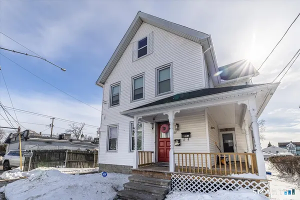 a view of a house with a barbeque