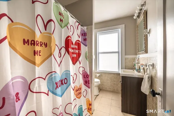 a bathroom with a bathtub and shower