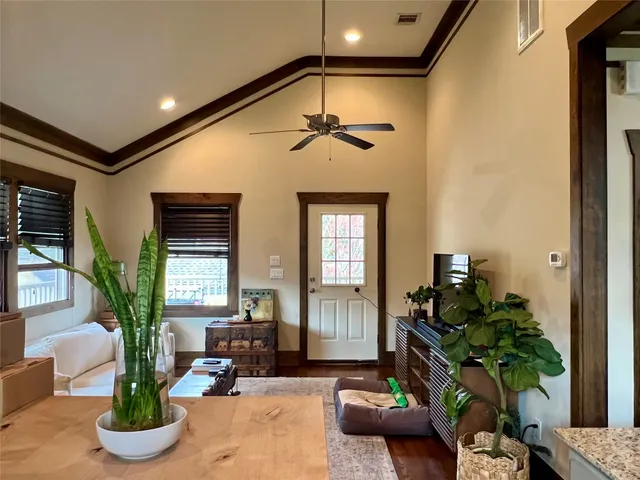 a kitchen with a sink dishwasher a refrigerator and cabinets
