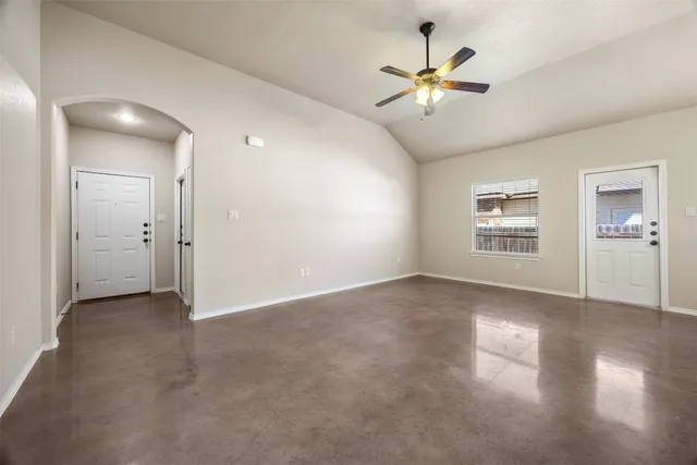 a view of an empty room with a window