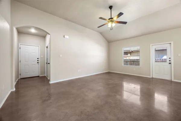 a view of an empty room with a window