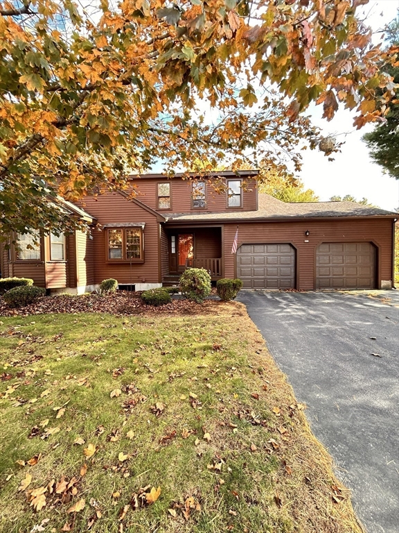 15 A Hawthorne Village, Unit D Franklin, MA 02038 - Photo 3 of 18 a front view of a house with a yard