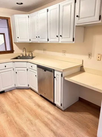 a view of cabinets with wooden floor