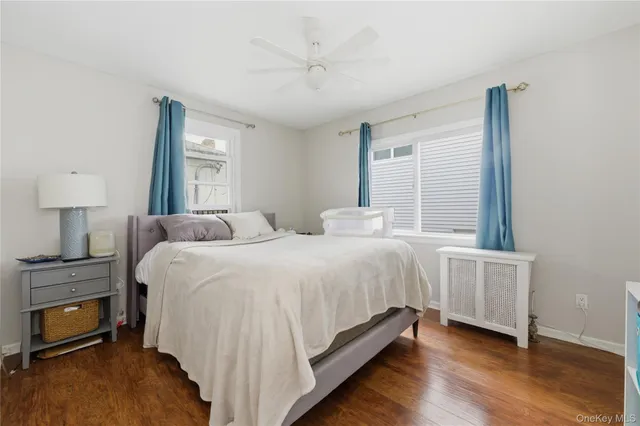 a bedroom with a bed and a night stand