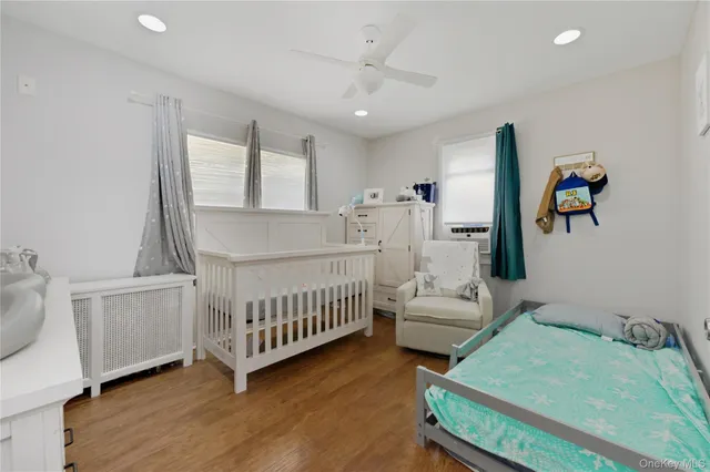 a bedroom with furniture and a window