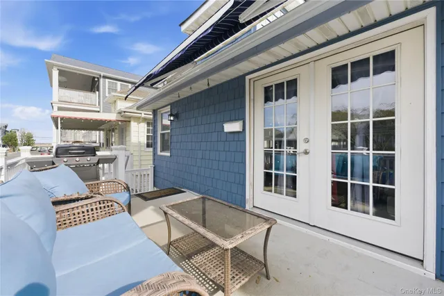 a outdoor living space with patio furniture and a window