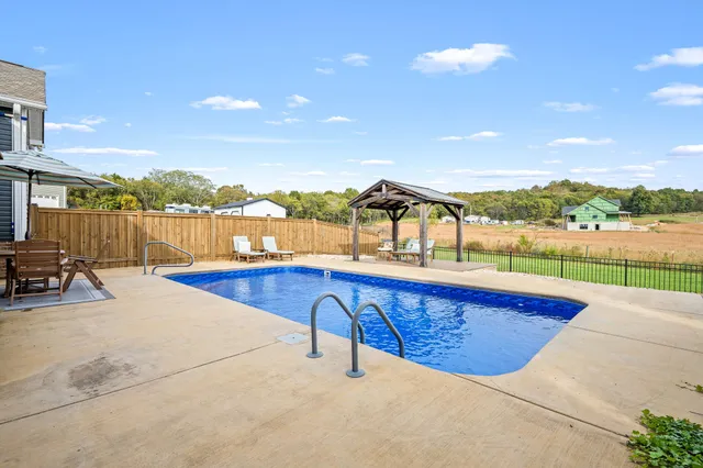a view of swimming pool with a lake view and mountain view