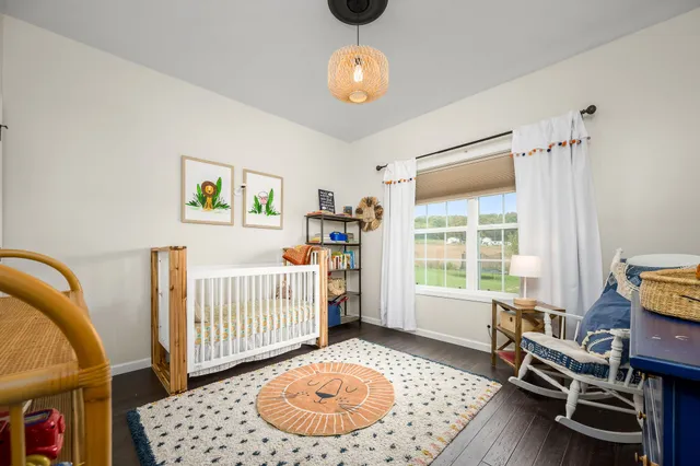 a bedroom with furniture and a window