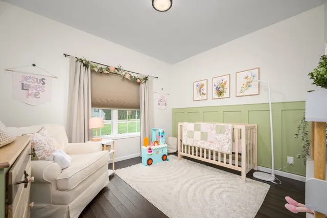 a bed room with furniture and window