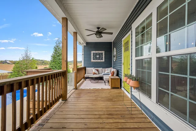 a view of a balcony with chairs