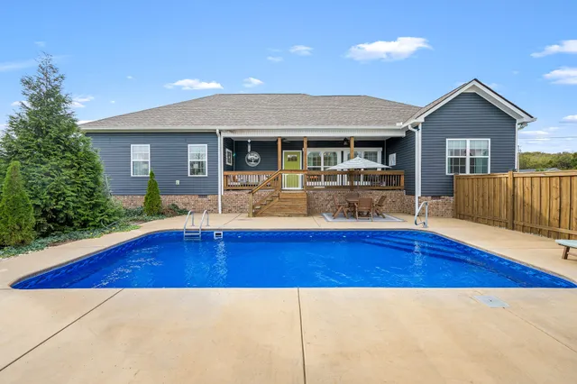 a view of swimming pool with seating space