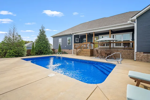 a view of swimming pool with outdoor seating