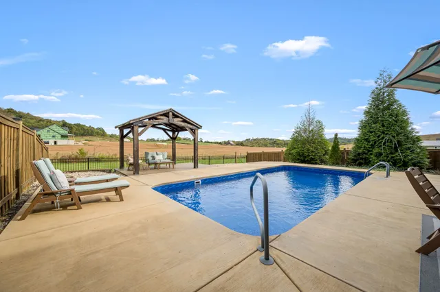 a view of a chairs and table in the patio