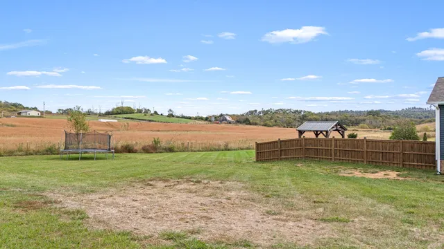 an aerial view of a house with a ocean view