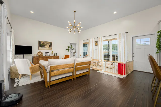 a spacious bedroom with bed and a flat screen tv