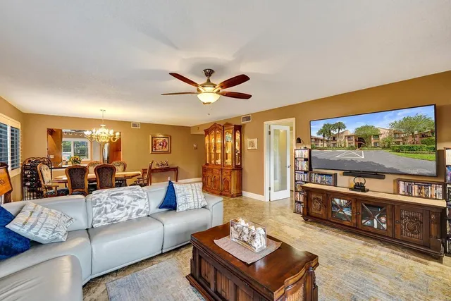 a dining room with furniture and windows