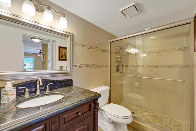 a view of a lake with houses in the back