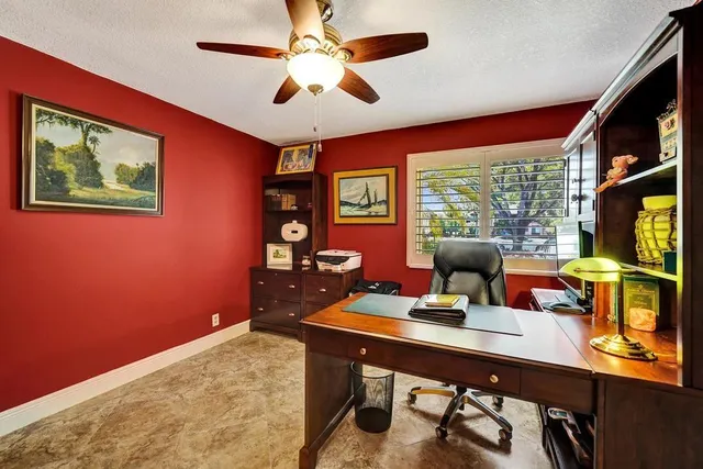 a view of a street with flower plants