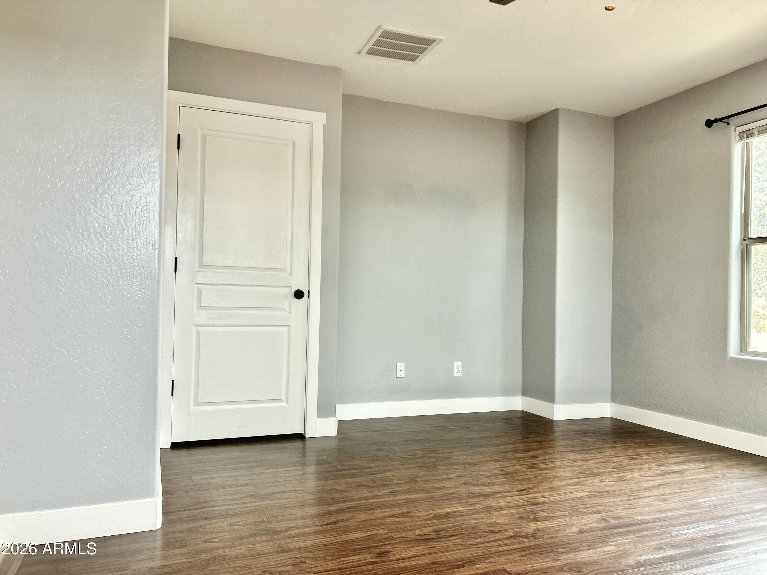451 South Hawes Road, Unit 43 Mesa, AZ 85208 - Photo 17 of 23 a view of room with window and wooden floor