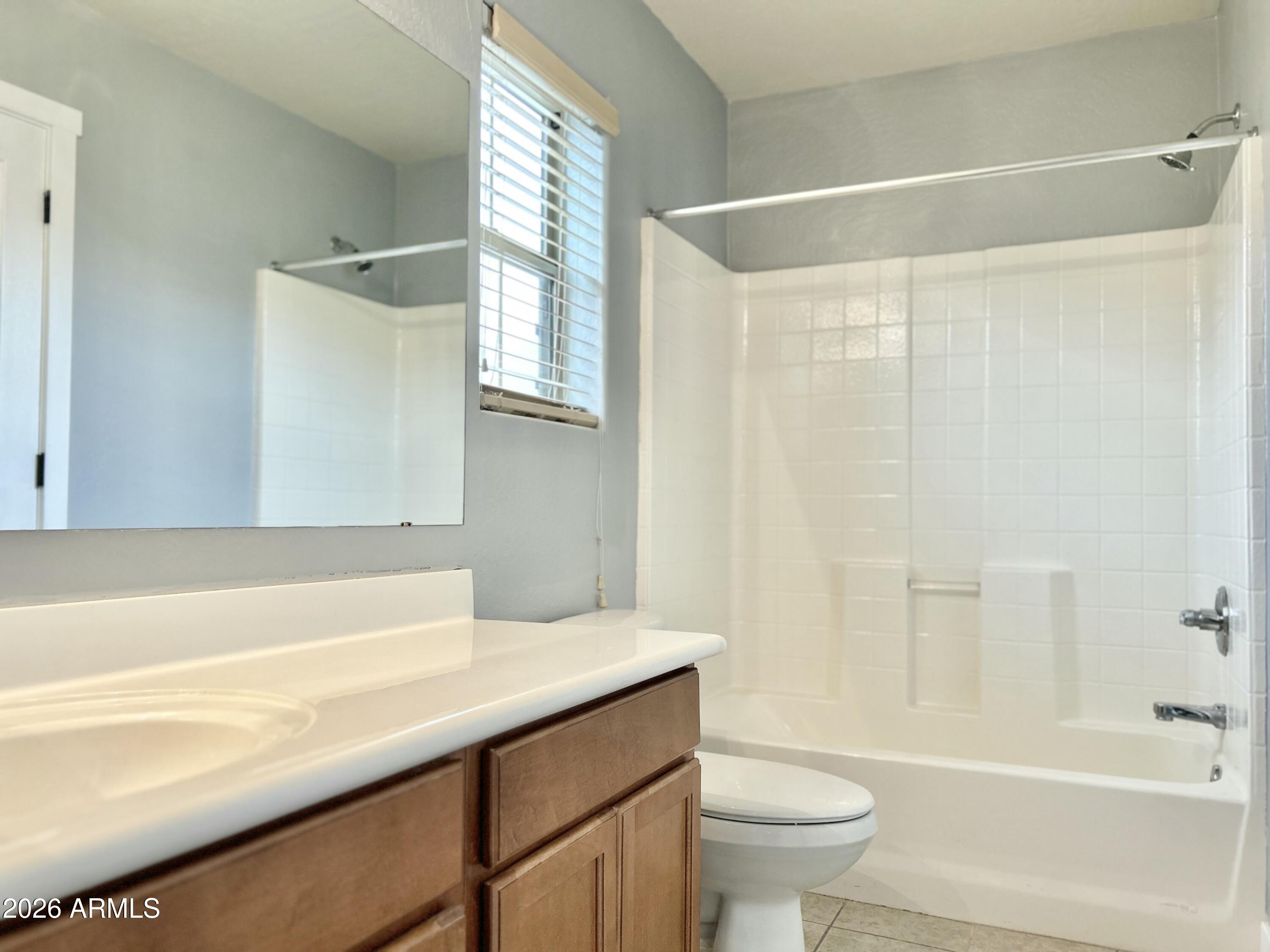 451 South Hawes Road, Unit 43 Mesa, AZ 85208 - Photo 21 of 23 a bathroom with a sink a toilet and a bathtub