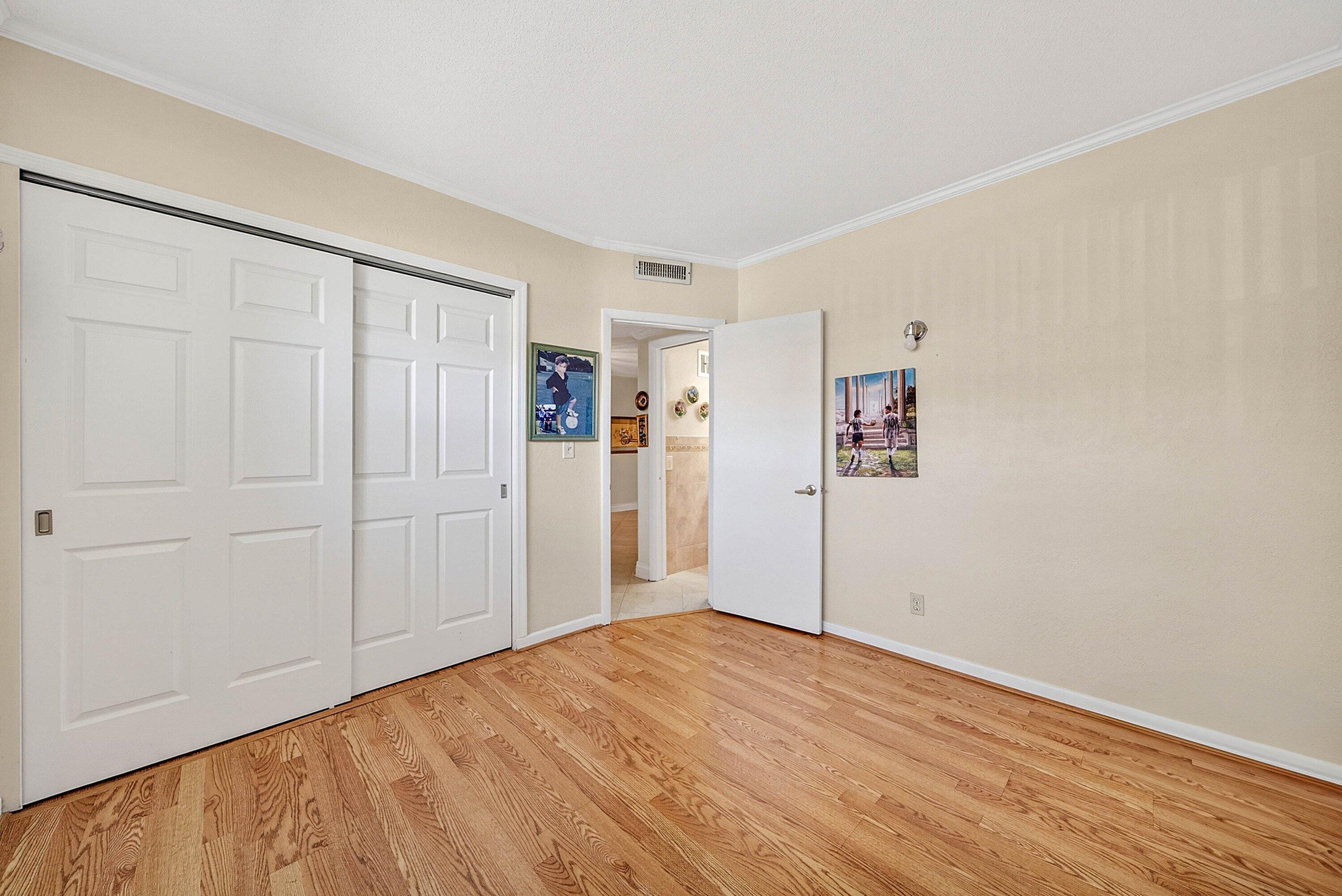 300 Northeast 20th Street, Unit 308 Boca Raton, FL 33431 - Photo 20 of 40 a view of empty room with wooden floor