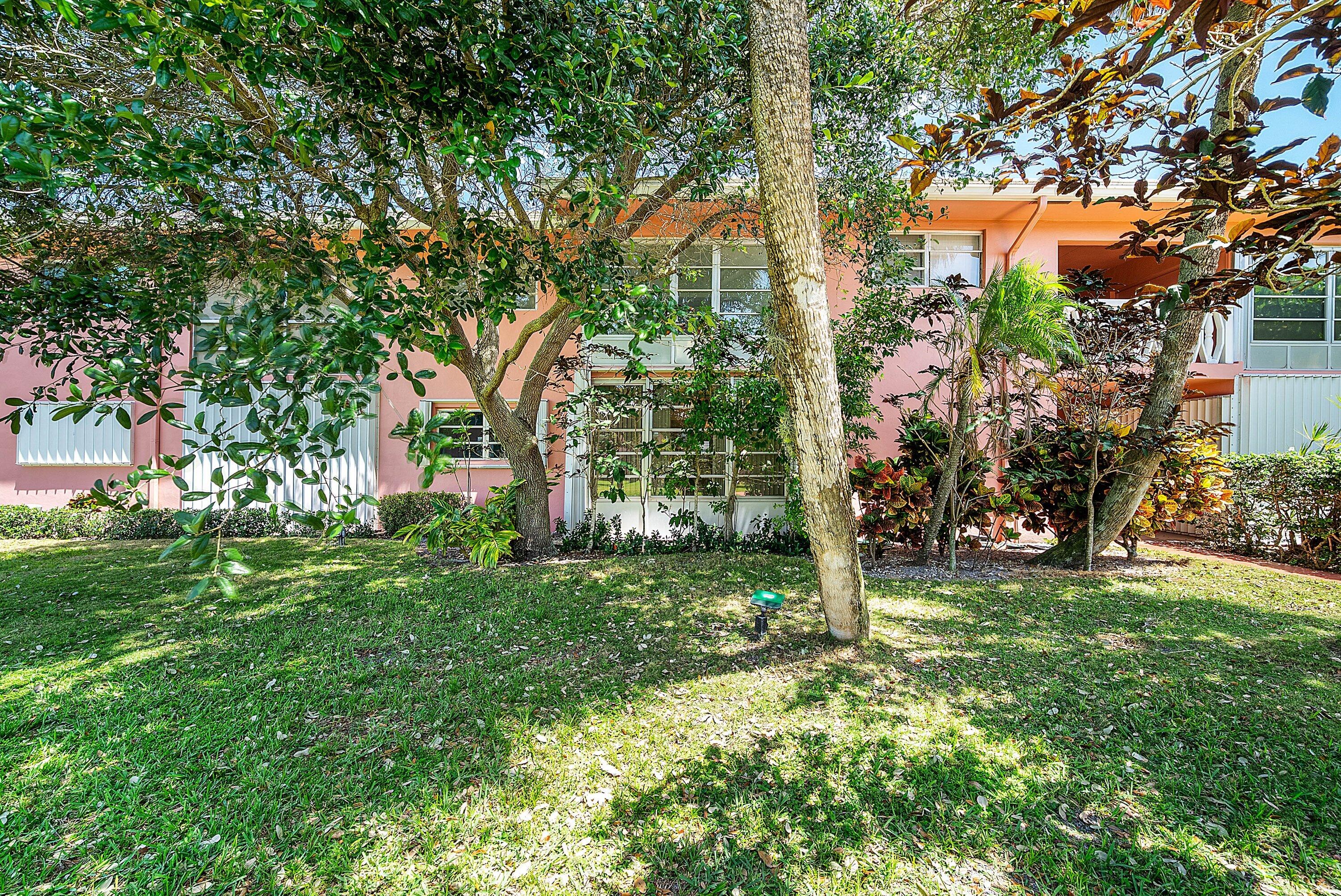 300 Northeast 20th Street, Unit 308 Boca Raton, FL 33431 - Photo 23 of 40 a view of a trees in front of a house