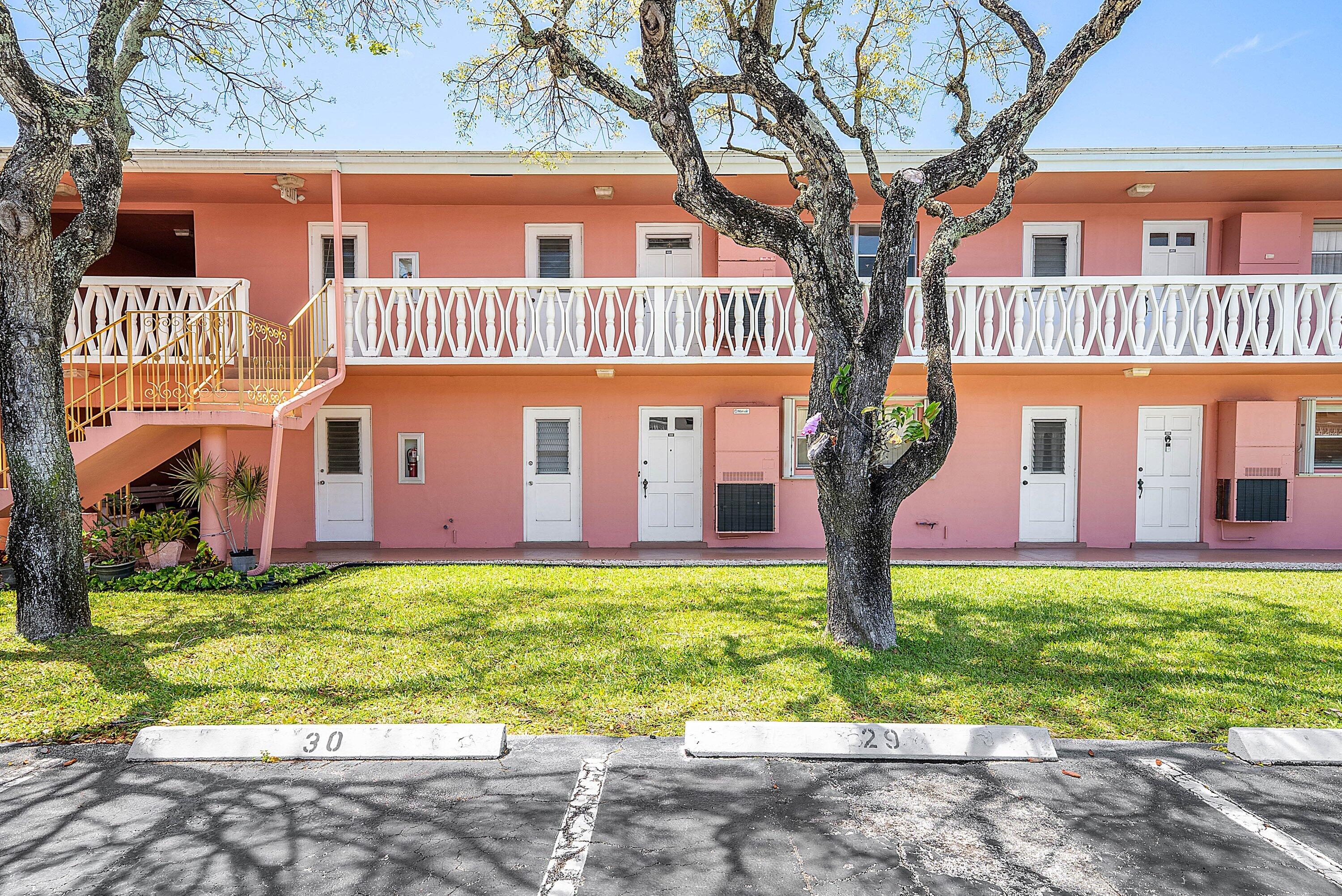 300 Northeast 20th Street, Unit 308 Boca Raton, FL 33431 - Photo 31 of 40 a front view of a building with garden
