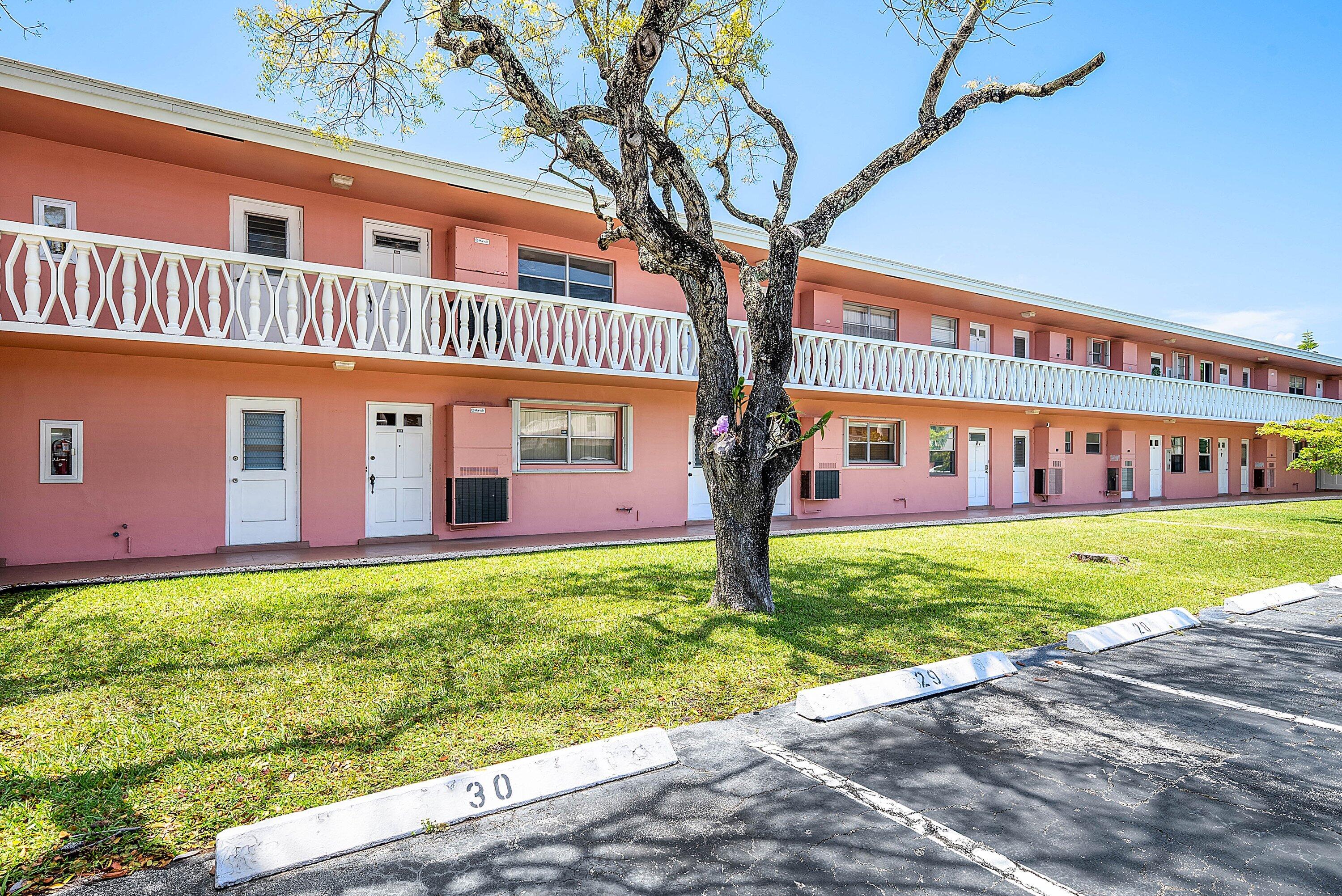 300 Northeast 20th Street, Unit 308 Boca Raton, FL 33431 - Photo 32 of 40 a front view of a house with garden