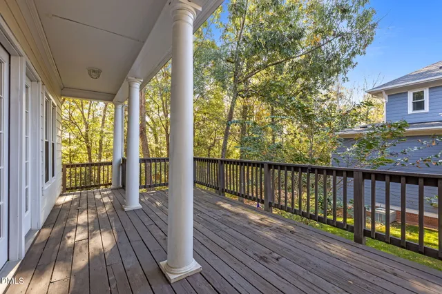 a view of balcony with wooden floor