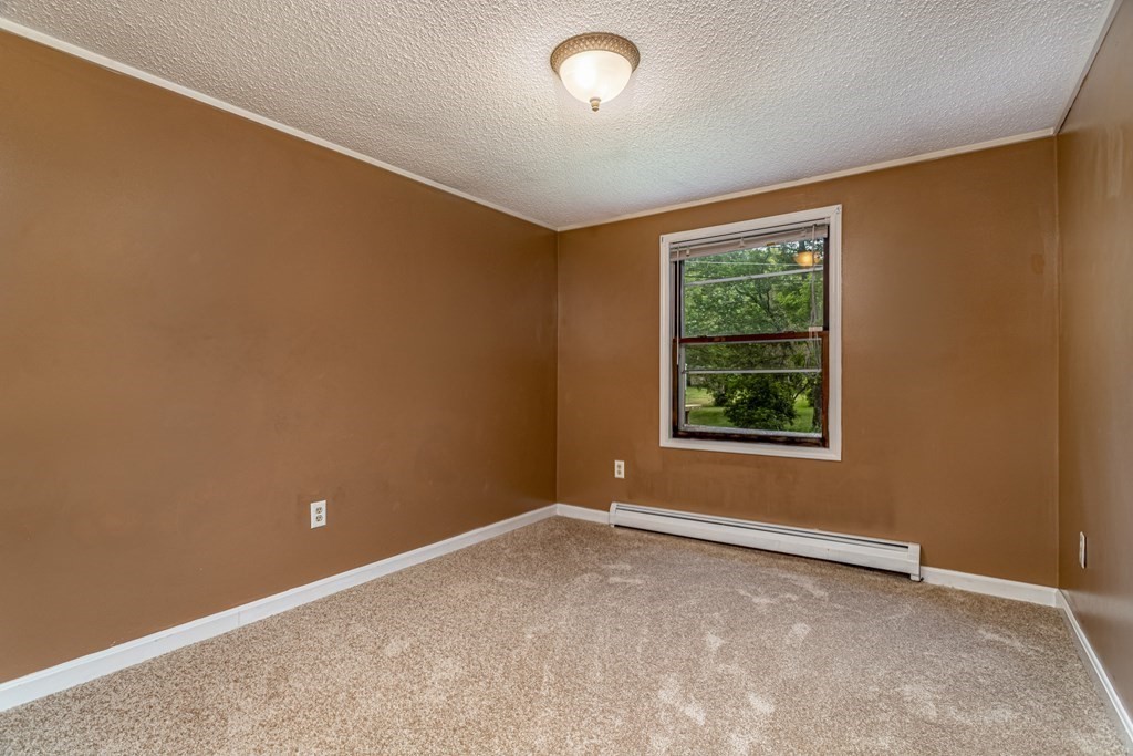 123 Dunn Road Ashburnham, MA 01430 - Photo 18 of 42 an empty room with windows