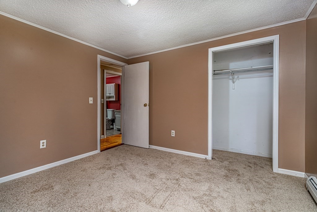 123 Dunn Road Ashburnham, MA 01430 - Photo 24 of 42 a view of an empty room with closet and a window