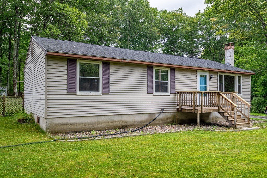 123 Dunn Road Ashburnham, MA 01430 - Photo 3 of 42 a view of a house with a backyard