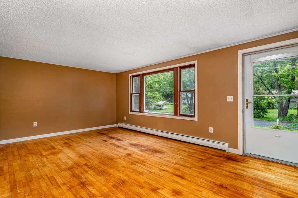 123 Dunn Road Ashburnham, MA 01430 - Photo 5 of 42 a view of an empty room with a window