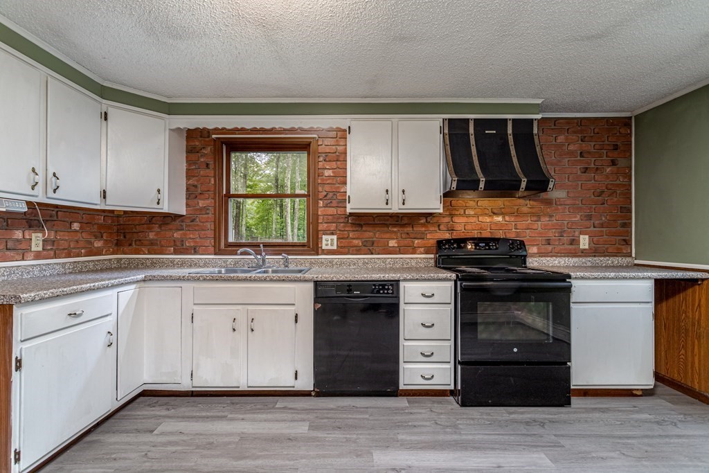123 Dunn Road Ashburnham, MA 01430 - Photo 10 of 42 a kitchen with stainless steel appliances granite countertop a stove and a sink