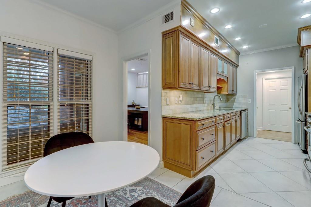 3520 Vinings Ridge Court Atlanta, GA 30339 - Photo 17 of 52 a kitchen with stainless steel appliances granite countertop a sink a stove a refrigerator a washer dryer and white cabinets