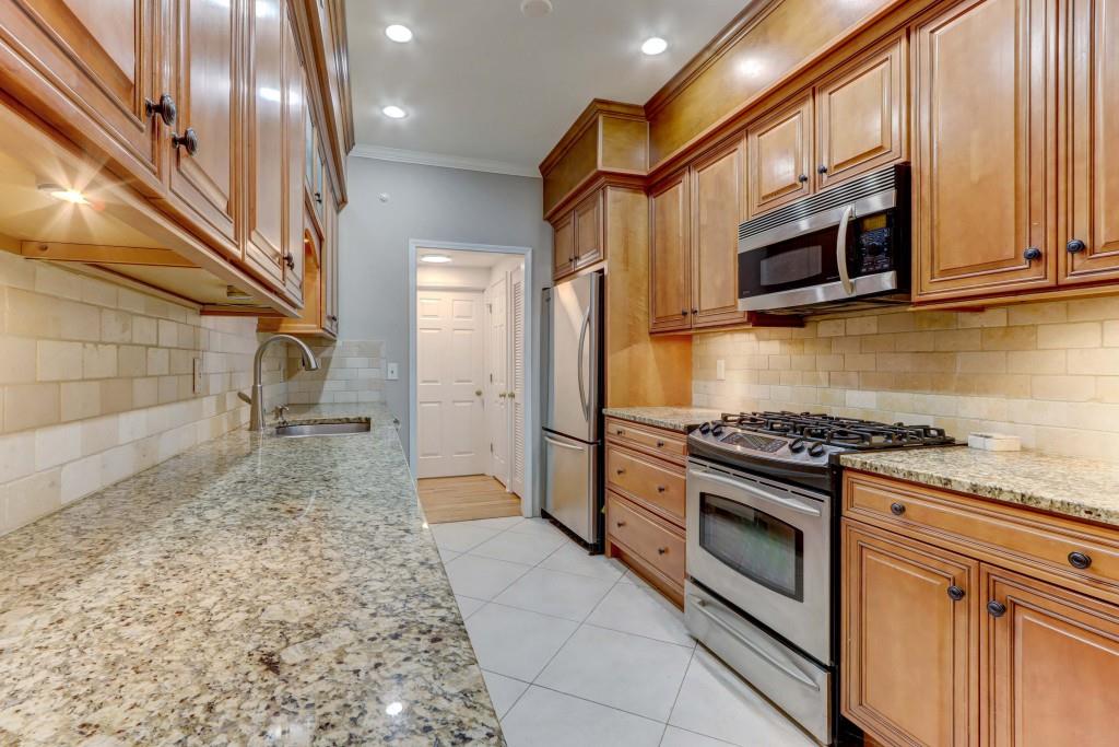 3520 Vinings Ridge Court Atlanta, GA 30339 - Photo 18 of 52 a kitchen with stainless steel appliances granite countertop a stove and a refrigerator