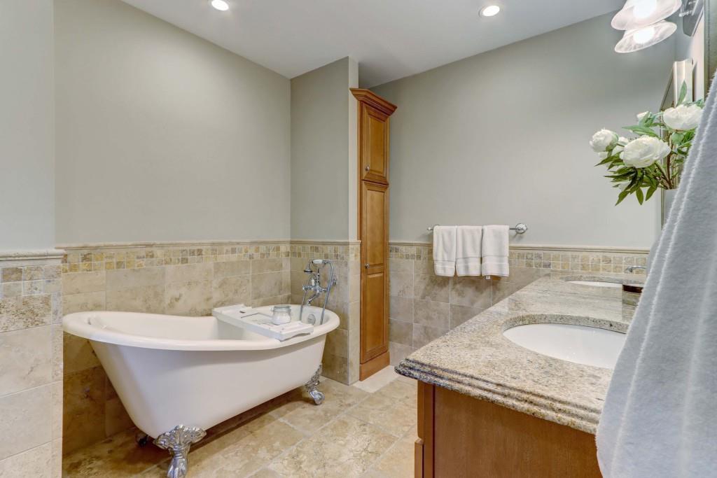 3520 Vinings Ridge Court Atlanta, GA 30339 - Photo 27 of 52 a spacious bathroom with a granite countertop sink and a bathtub