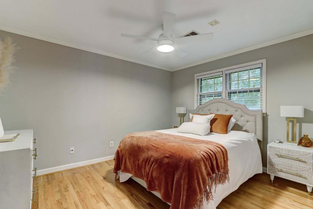 3520 Vinings Ridge Court Atlanta, GA 30339 - Photo 29 of 52 a bed sitting in a bedroom next to a window