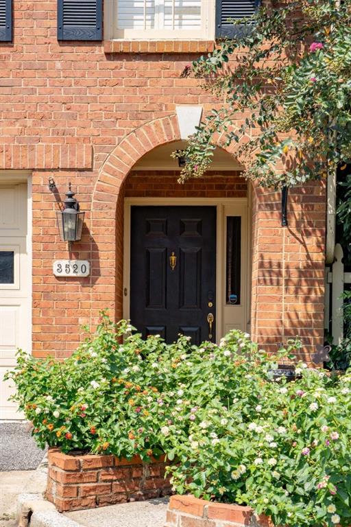 3520 Vinings Ridge Court Atlanta, GA 30339 - Photo 3 of 52 a front view of a house with lots of flowers
