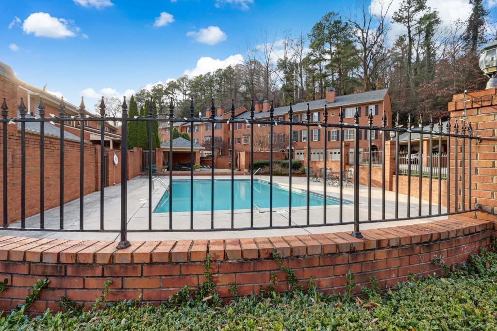3520 Vinings Ridge Court Atlanta, GA 30339 - Photo 38 of 52 a view of a backyard with a wooden fence