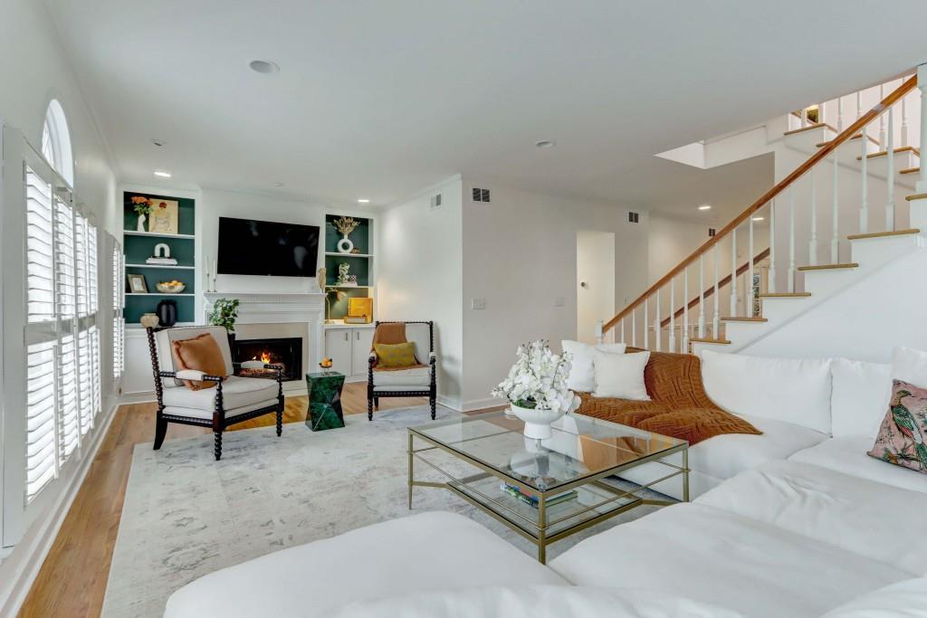 3520 Vinings Ridge Court Atlanta, GA 30339 - Photo 8 of 52 a living room with furniture a flat screen tv and a fireplace