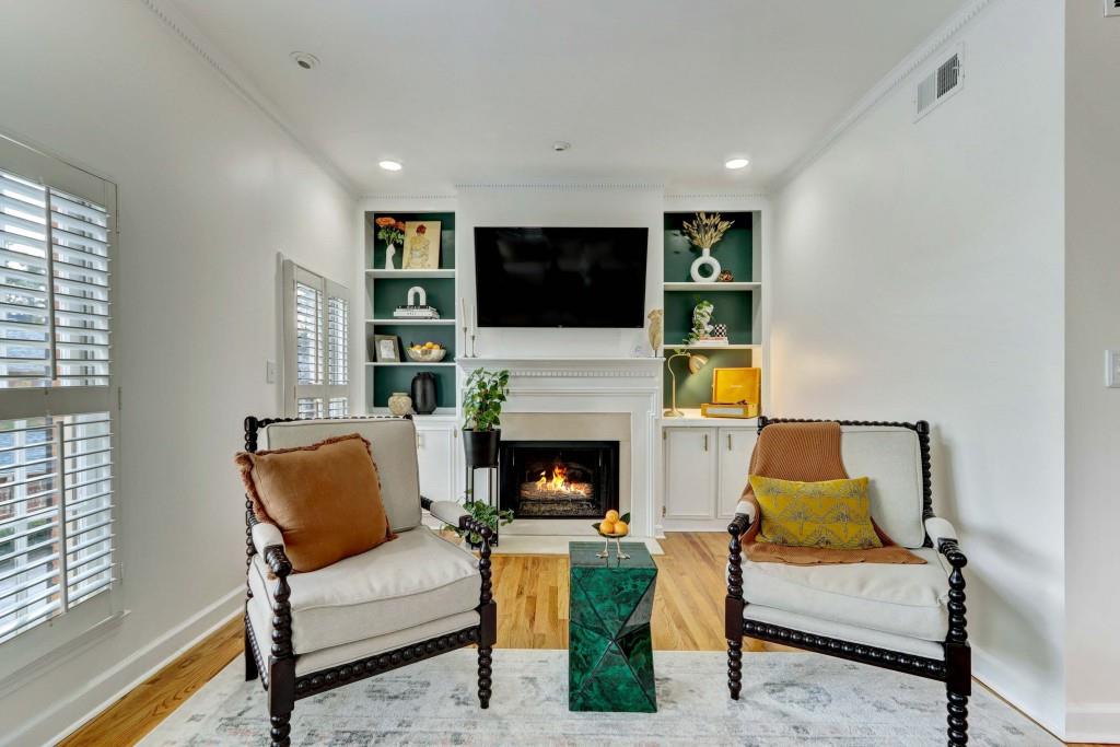 3520 Vinings Ridge Court Atlanta, GA 30339 - Photo 10 of 52 a living room with furniture a flat screen tv and a fireplace