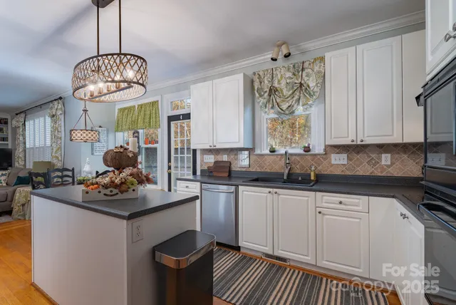 a kitchen with a sink stove and cabinets