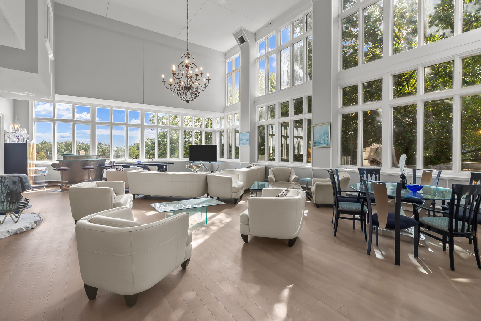 7830 North Pillow Hill Road Spring Grove, IL 60081 - Photo 34 of 69 a living room with patio furniture and a chandelier