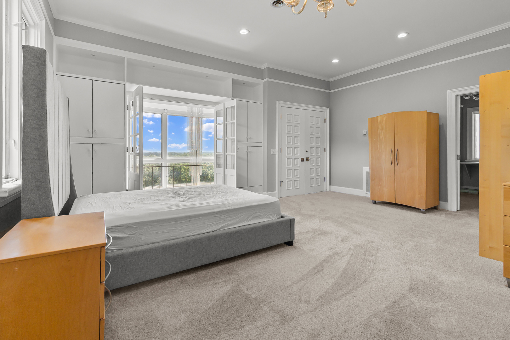 7830 North Pillow Hill Road Spring Grove, IL 60081 - Photo 38 of 69 a spacious bedroom with a bed and a refrigerator