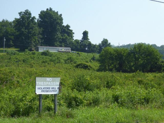 15 Industrial Park Road Carmichaels, PA 15320 - Photo 3 of 7 a sign board with tall trees in the background