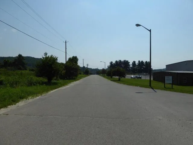 a view of a road with a park