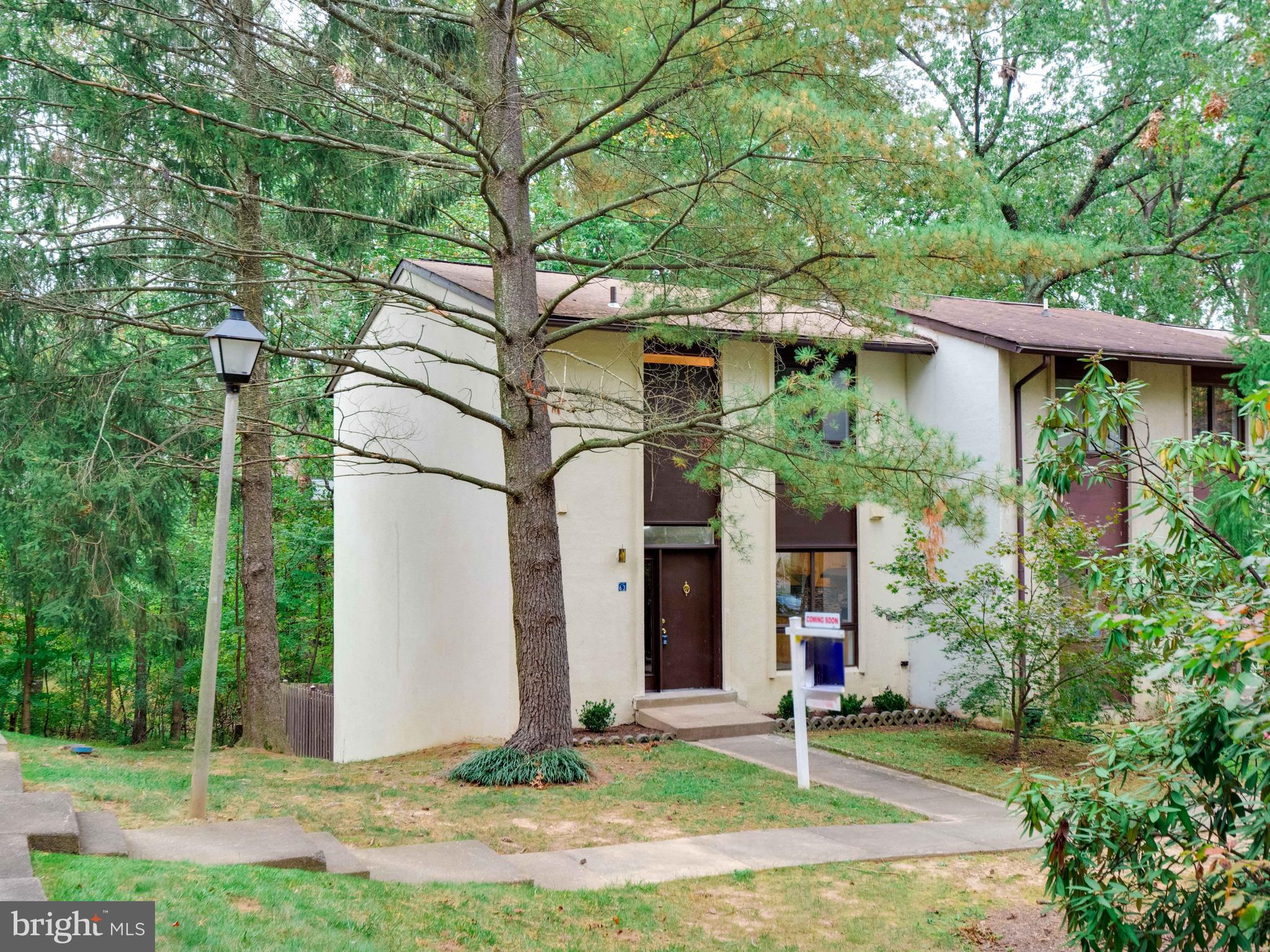 11963 Barrel Cooper Court Reston, VA 20191 - Photo 1 of 33 a front view of a house with garden