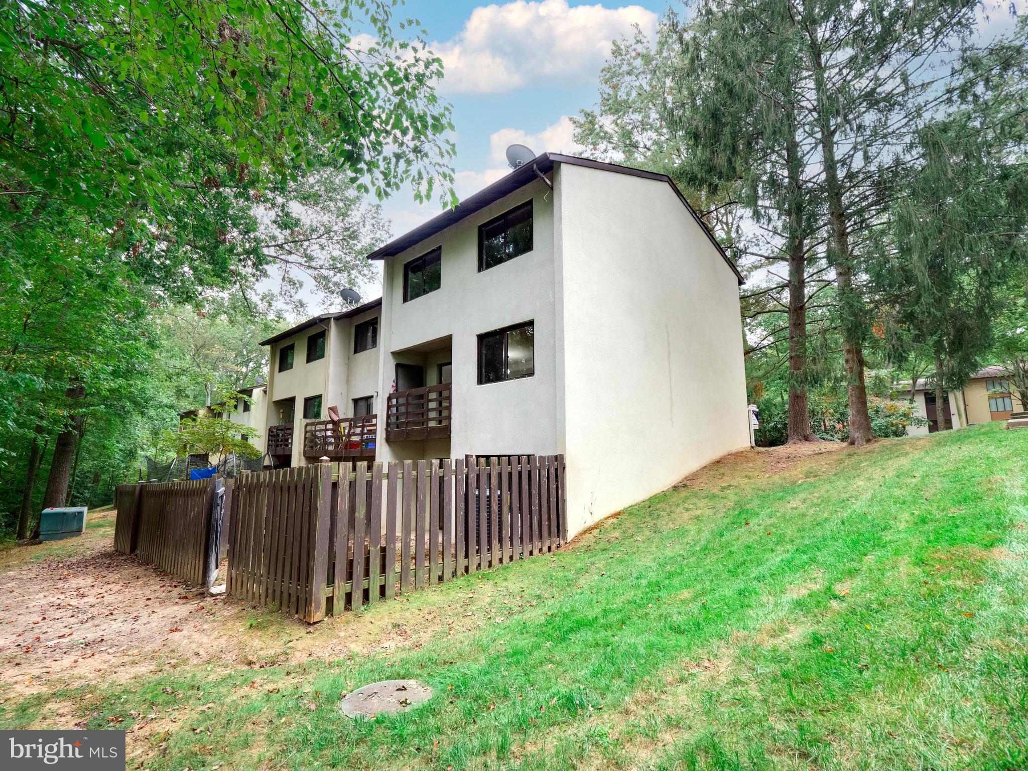 11963 Barrel Cooper Court Reston, VA 20191 - Photo 2 of 33 a front view of a house with a yard
